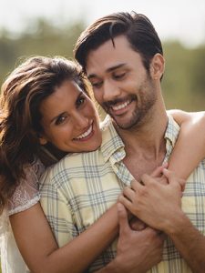 Couple with healthy teeth smiling