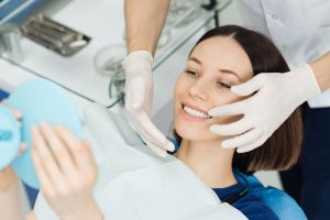 Woman admiring teeth